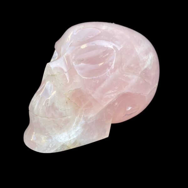 Life-size rose quartz skull