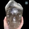 elestial-smoky-quartz-skull0-1.jpeg Elestial smoky quartz skull with green muscovite