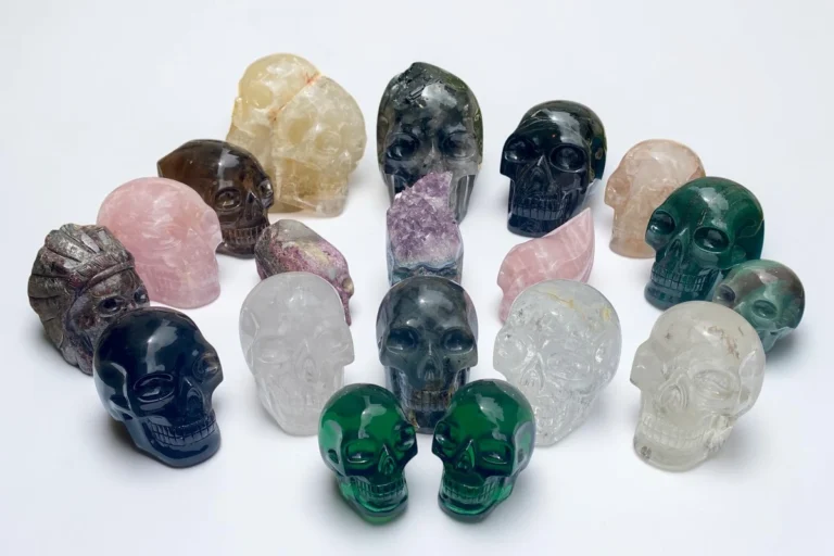 A large group of different crystal skulls