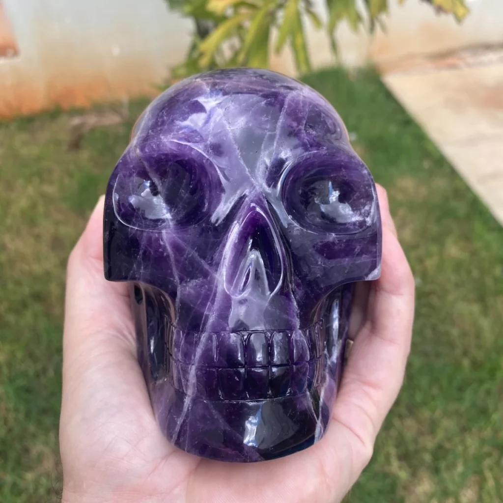 Crystal Skull Meaning: What They Symbolize, And What Each Stone Means 2 Close-up of a hand-carved Brazilian amethyst crystal skull